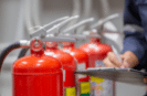 compliance person checking fire extinguishers