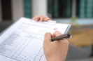 Person filling out form for compliance EPCI code admin services